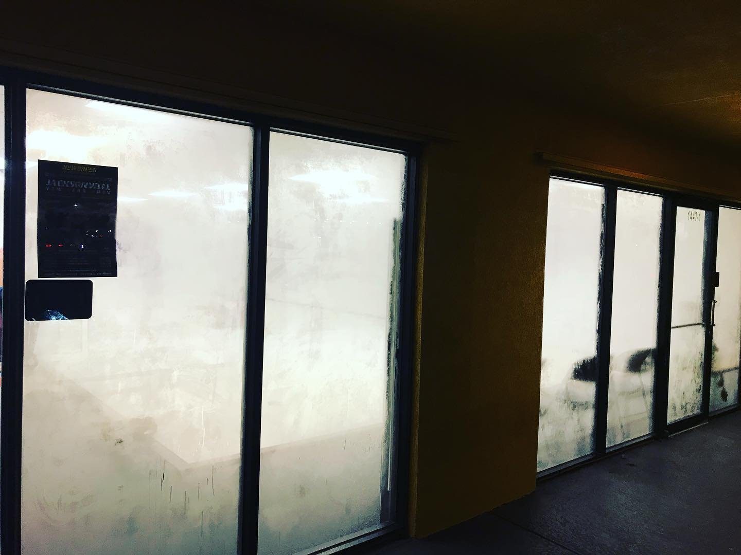 Steamed storefront windows at 1447 Mayport Road Unit 1 during an evening training session.