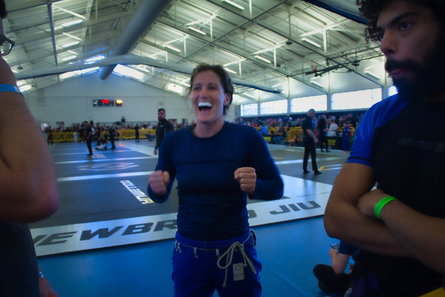 Mentality Martial Arts competitor celebrating a match win on Newbreed Jiu-Jitsu tournament mats.